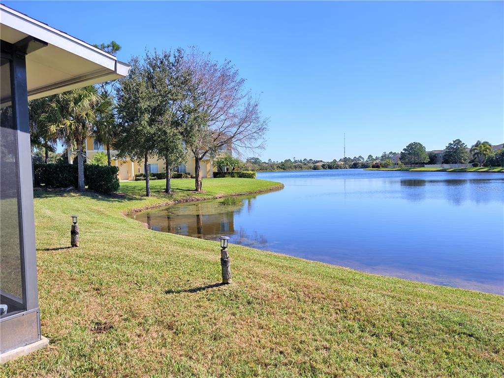 11997 Tempest Harbor Loop Venice, FL 34292 - Photo 12 of 52 a swimming pool with outdoor seating and yard
