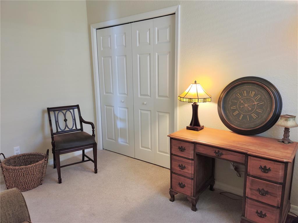 11997 Tempest Harbor Loop Venice, FL 34292 - Photo 29 of 52 a living room with furniture and a mirror