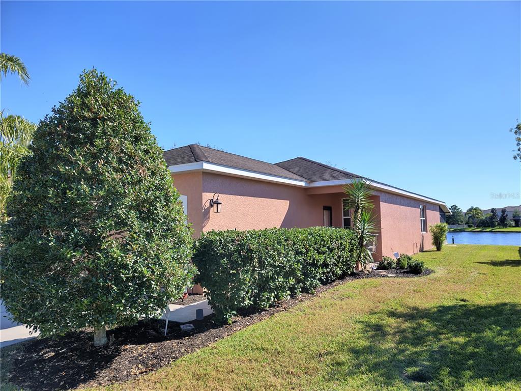 11997 Tempest Harbor Loop Venice, FL 34292 - Photo 3 of 52 a front view of a house with a yard and garage