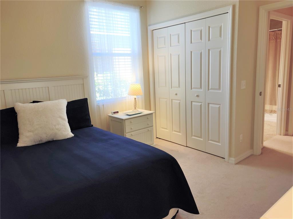 11997 Tempest Harbor Loop Venice, FL 34292 - Photo 37 of 52 a bedroom with a bed and a window