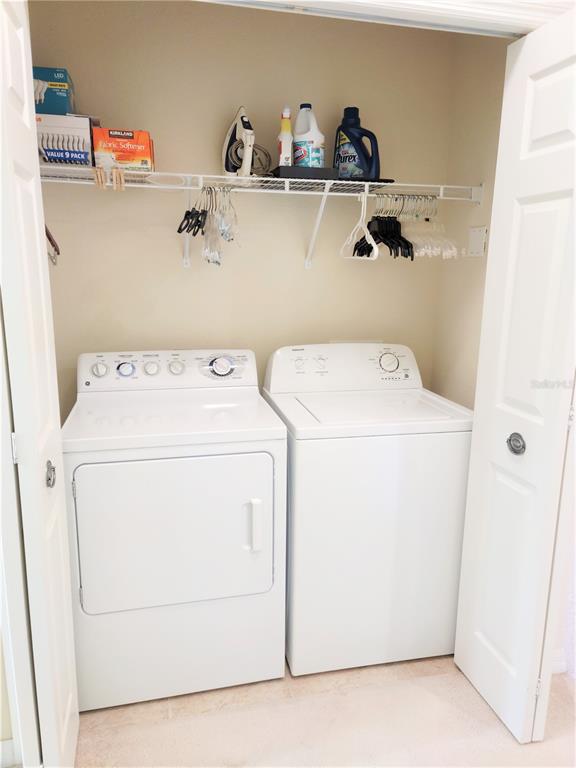11997 Tempest Harbor Loop Venice, FL 34292 - Photo 39 of 52 a utility room with dryer and washer