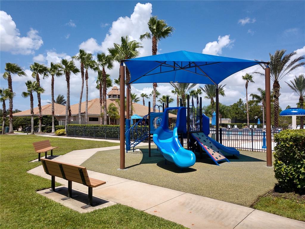 11997 Tempest Harbor Loop Venice, FL 34292 - Photo 46 of 52 a view of a swimming pool with a patio and a garden