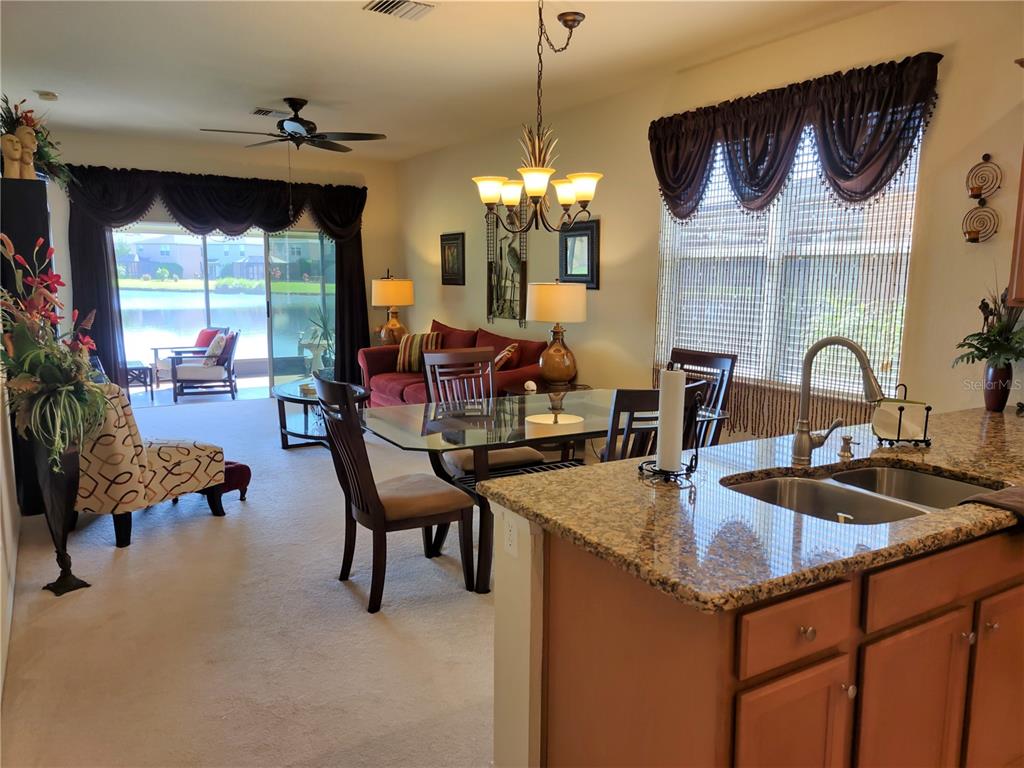 11997 Tempest Harbor Loop Venice, FL 34292 - Photo 8 of 52 a kitchen with sink and view of living room