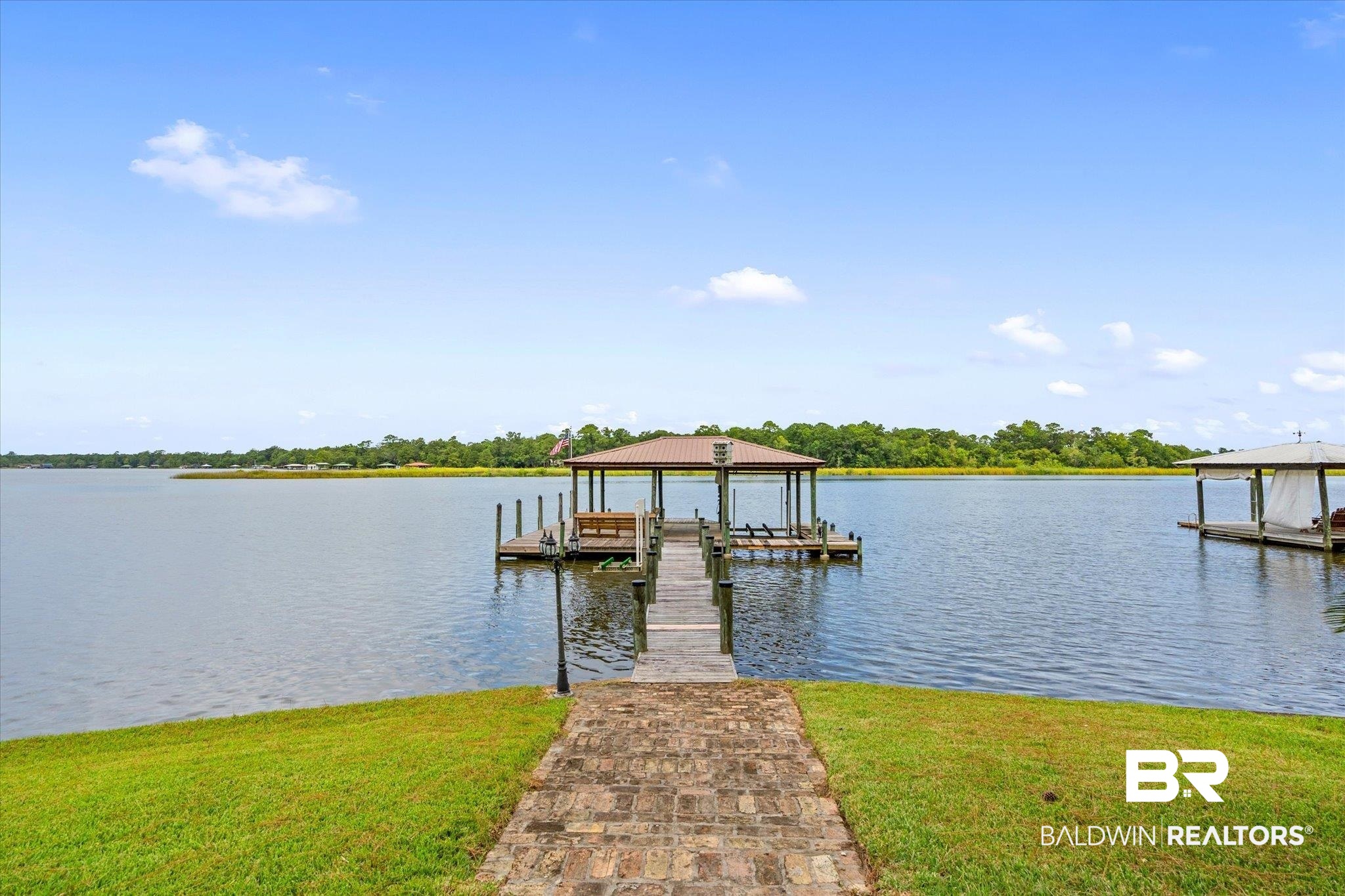 2228 Riverside Drive Mobile, AL 36605 - Photo 3 of 51 View of dock with a water view and a lawn