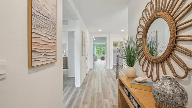 a view of a livingroom with furniture and wooden floor