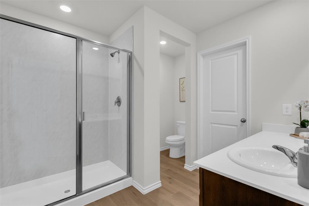 6513 Waterfall Lane Princeton, TX 75407 - Photo 15 of 35 a bathroom with a sink toilet and shower