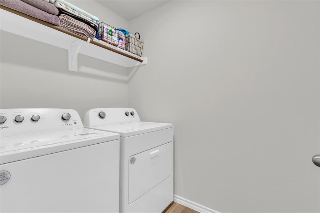 6513 Waterfall Lane Princeton, TX 75407 - Photo 20 of 35 a utility room with dryer and washer