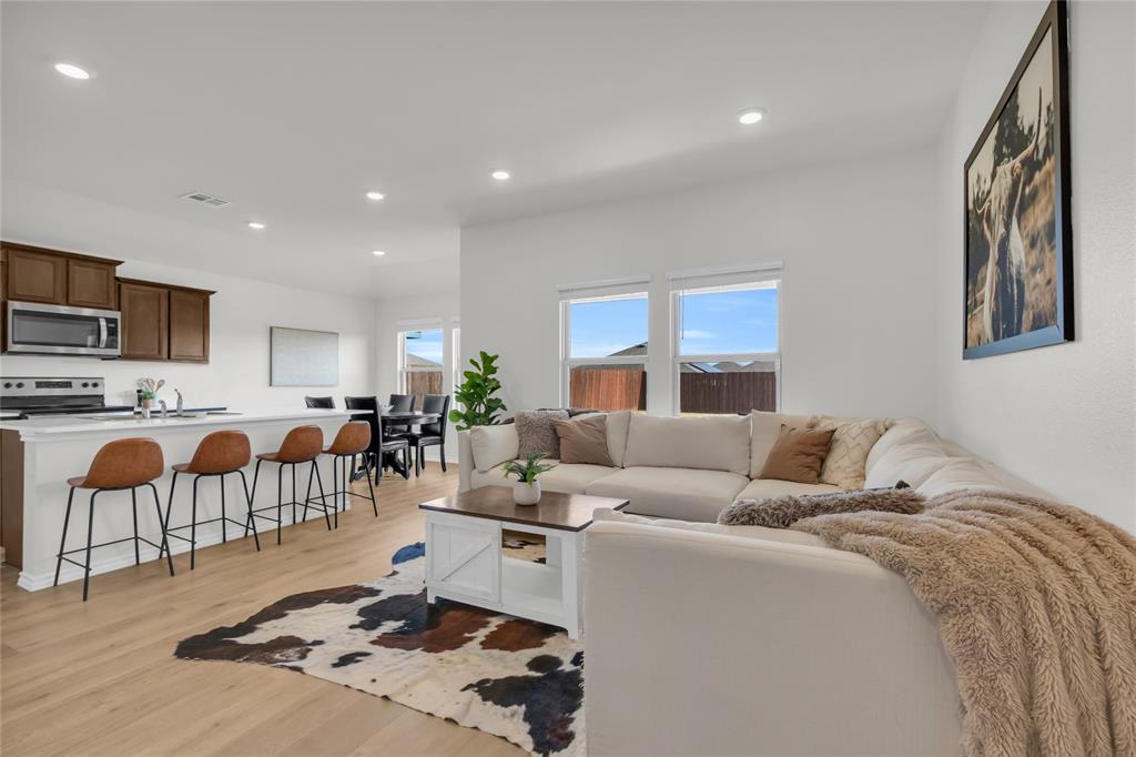 6513 Waterfall Lane Princeton, TX 75407 - Photo 2 of 35 a living room with furniture kitchen view and a window