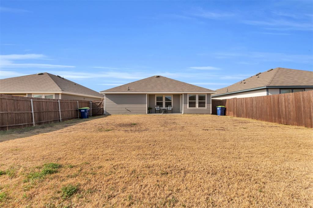 6513 Waterfall Lane Princeton, TX 75407 - Photo 24 of 35 a front view of a house with a yard
