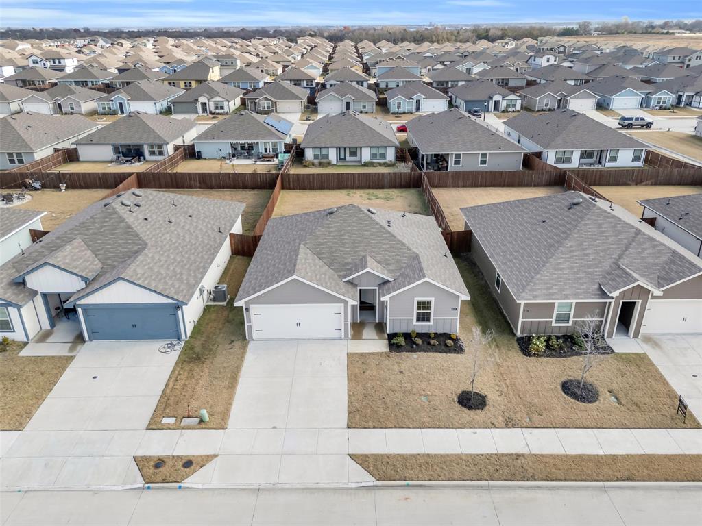 6513 Waterfall Lane Princeton, TX 75407 - Photo 25 of 35 an aerial view of a house with swimming pool