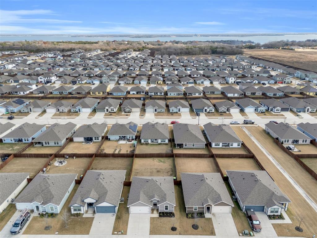 6513 Waterfall Lane Princeton, TX 75407 - Photo 28 of 35 an aerial view of residential building with parking