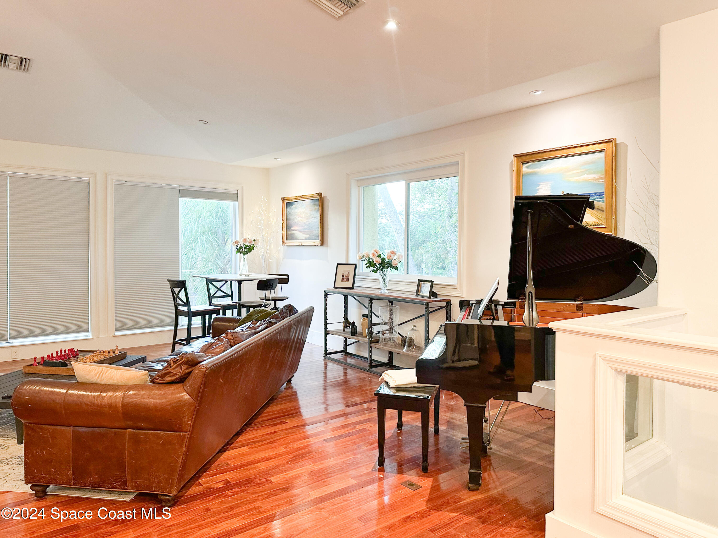 143 Caledonia Drive Melbourne Beach, FL 32951 - Photo 13 of 57 a living room with furniture and a large window