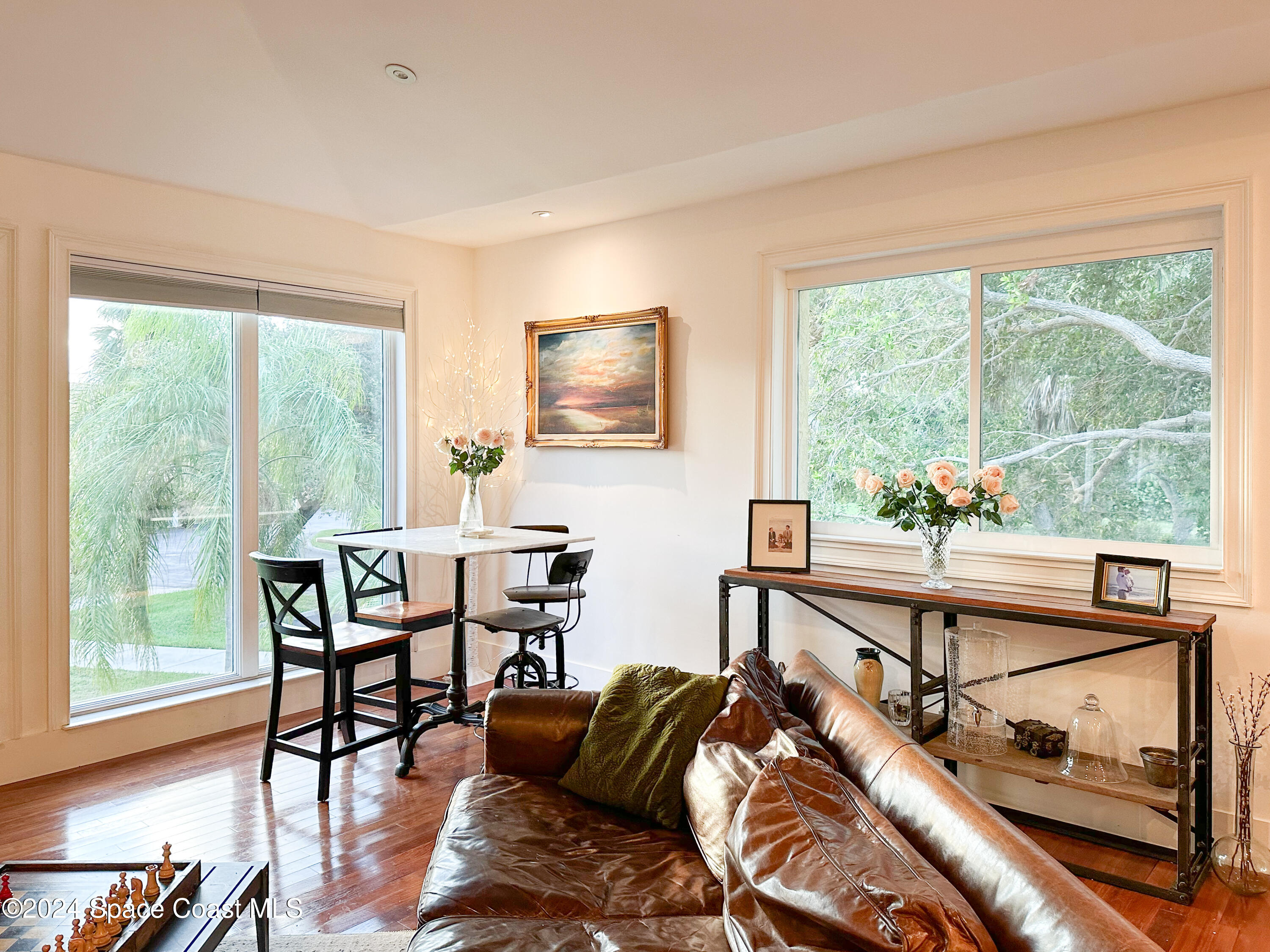 143 Caledonia Drive Melbourne Beach, FL 32951 - Photo 17 of 57 a living room with furniture and a window