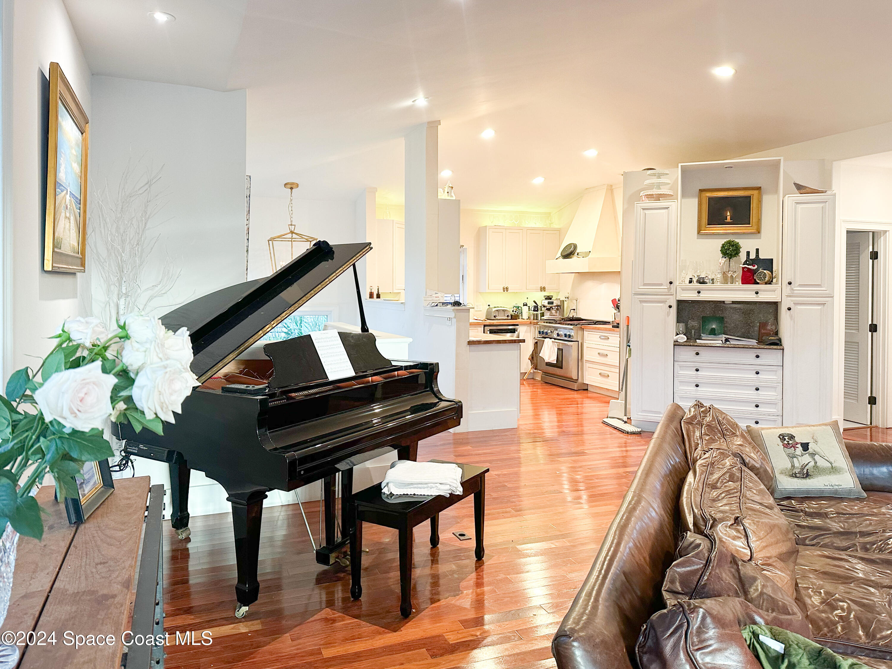143 Caledonia Drive Melbourne Beach, FL 32951 - Photo 24 of 57 a living room with furniture and wooden floor