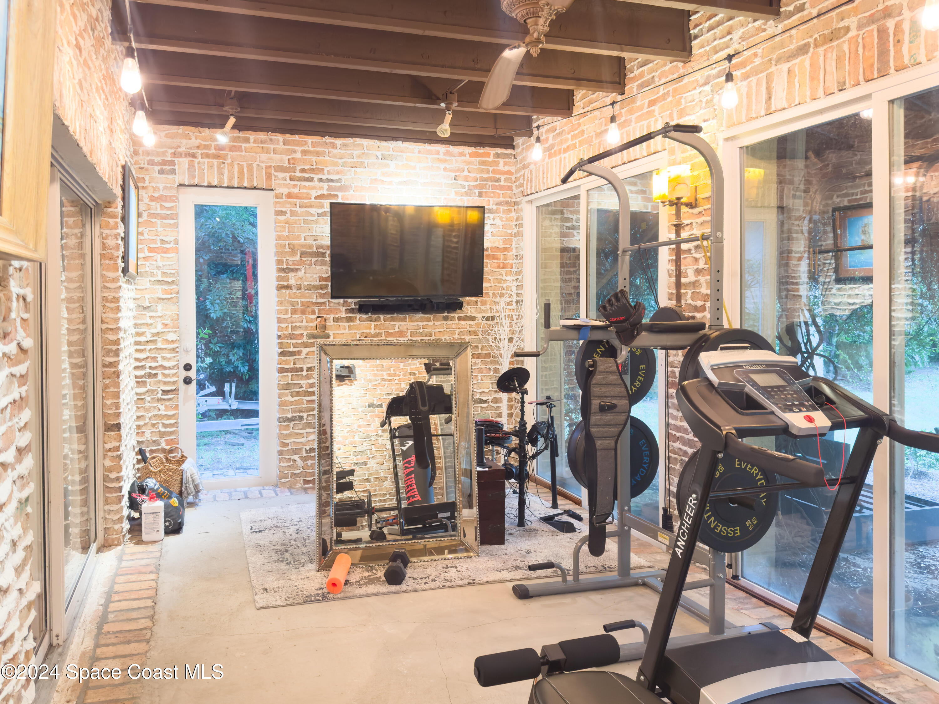 143 Caledonia Drive Melbourne Beach, FL 32951 - Photo 29 of 57 a view of a livingroom with furniture window and outside view