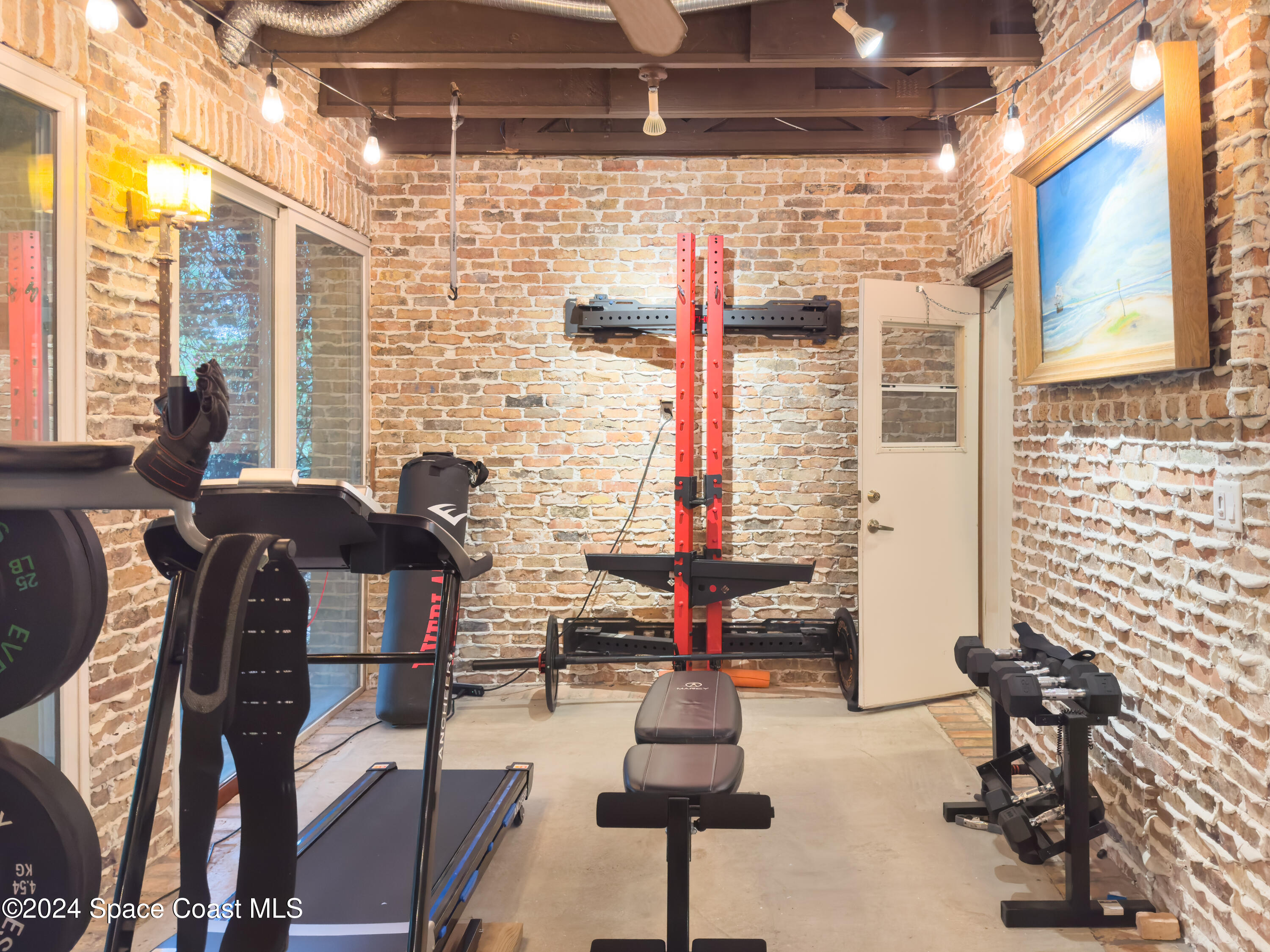 143 Caledonia Drive Melbourne Beach, FL 32951 - Photo 30 of 57 a outdoor space with the couches and chairs