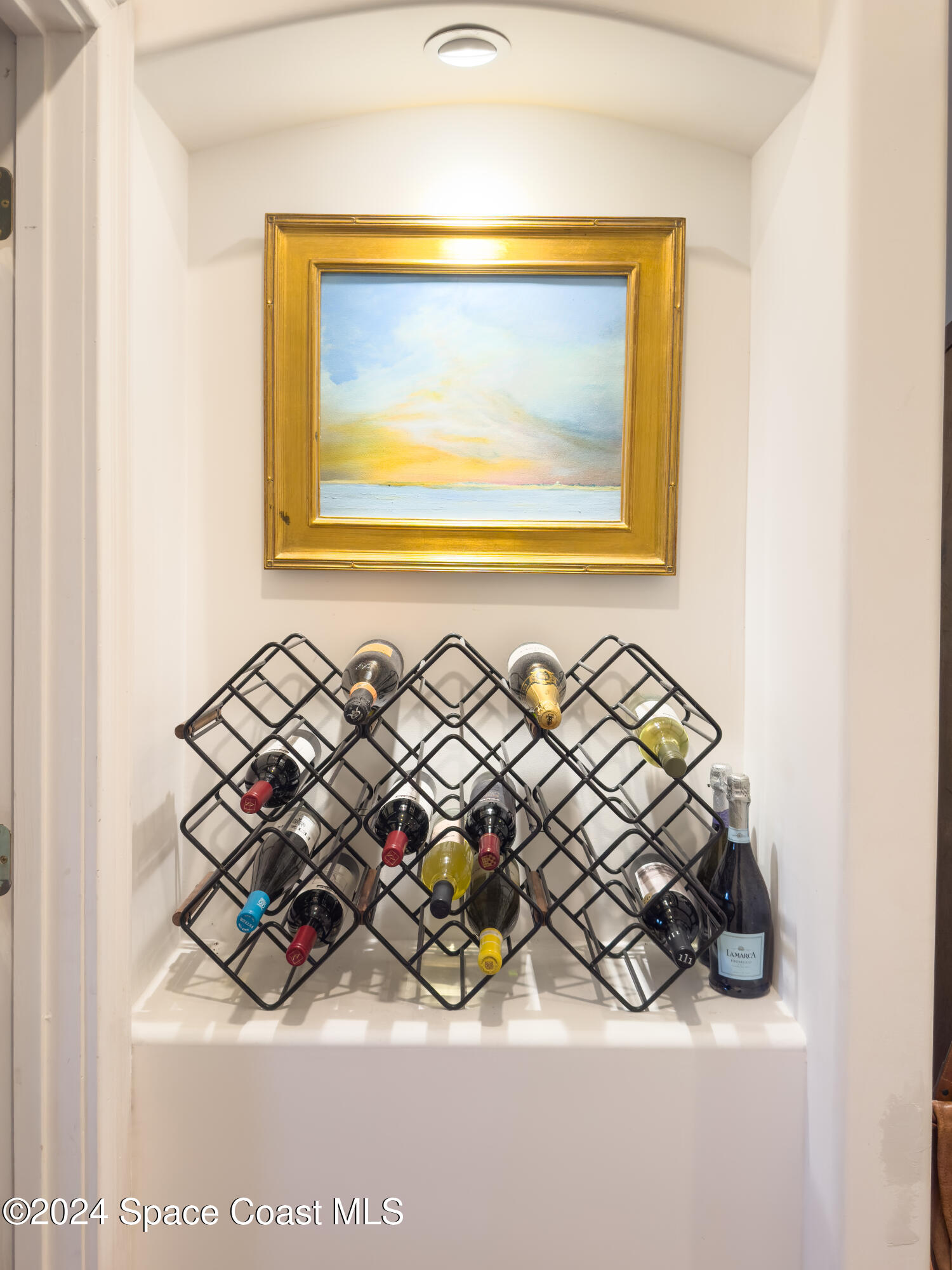 143 Caledonia Drive Melbourne Beach, FL 32951 - Photo 31 of 57 a bathroom with a sink and a mirror