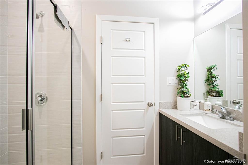 5609 Swallow Avenue, Unit 1 Mission, TX 78573 - Photo 12 of 15 Bathroom featuring vanity and a shower stall