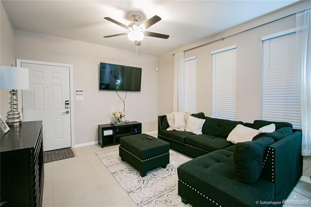5609 Swallow Avenue, Unit 1 Mission, TX 78573 - Photo 3 of 15 Living room with baseboards and a ceiling fan