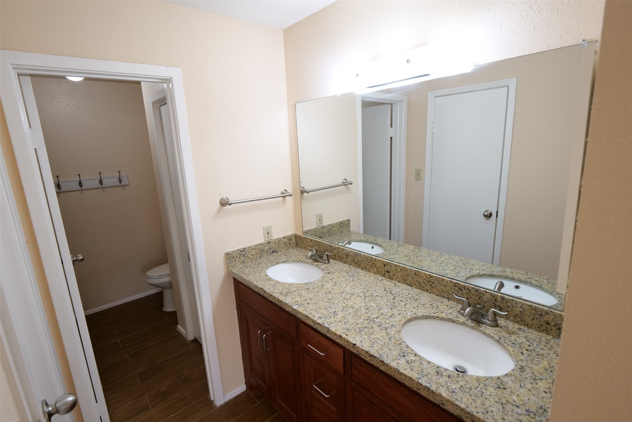 14911 Wunderlich Drive, Unit 2105 Houston, TX 77069 - Photo 13 of 24 a bathroom with a granite countertop sink and a mirror