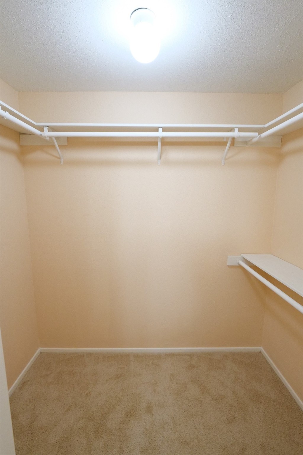 14911 Wunderlich Drive, Unit 2105 Houston, TX 77069 - Photo 15 of 24 a view of a room with racks on the wall