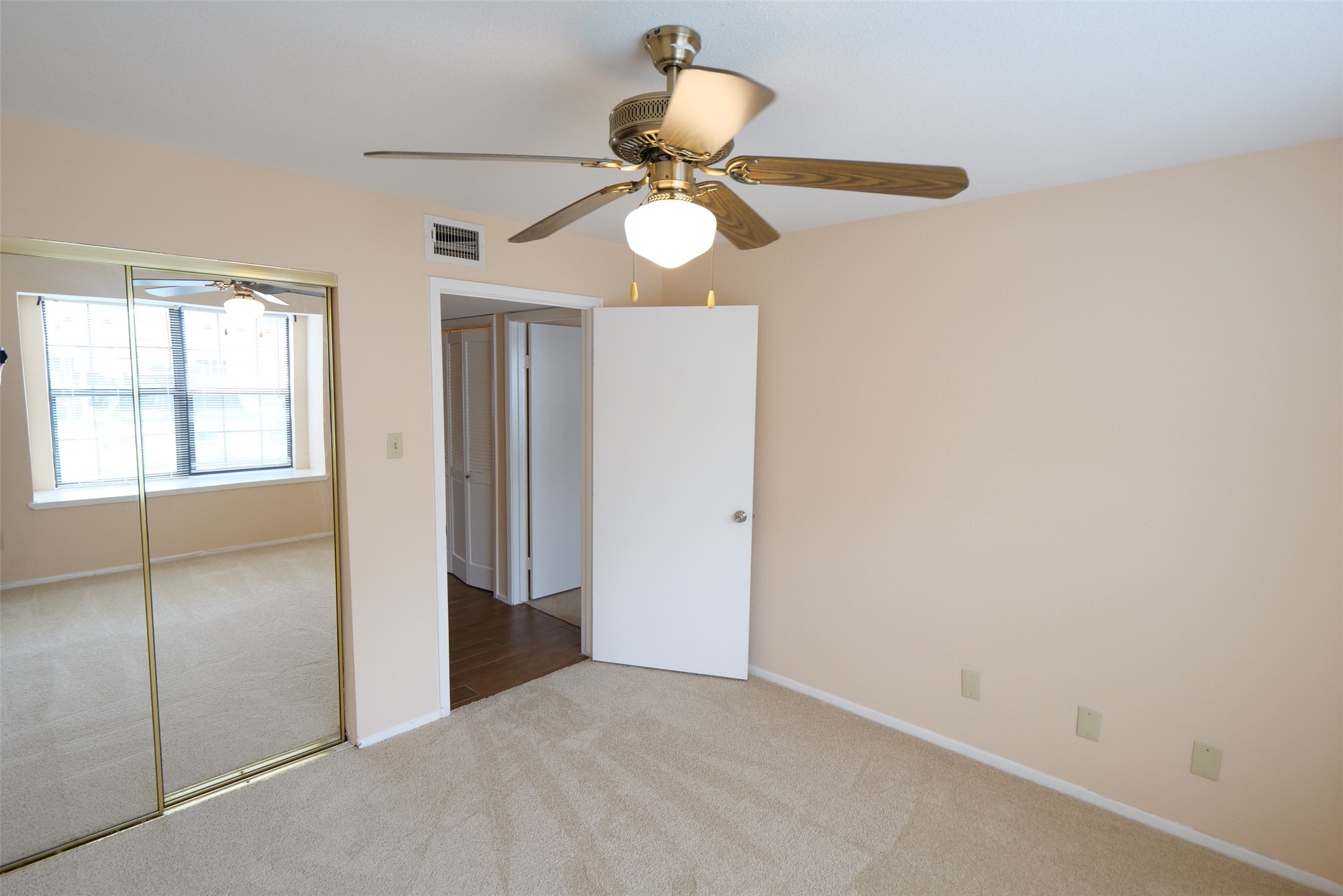 14911 Wunderlich Drive, Unit 2105 Houston, TX 77069 - Photo 19 of 24 en view of an empty room with a window