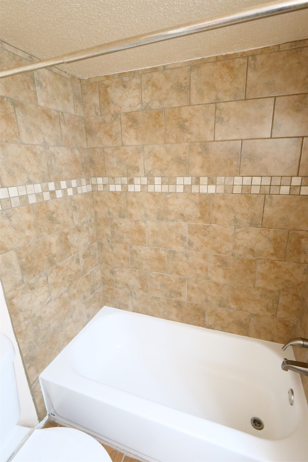 14911 Wunderlich Drive, Unit 2105 Houston, TX 77069 - Photo 22 of 24 a bathroom with a bathtub and shower