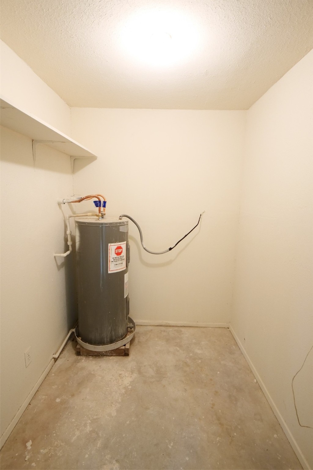 14911 Wunderlich Drive, Unit 2105 Houston, TX 77069 - Photo 24 of 24 a view of storage and utility room with utility room