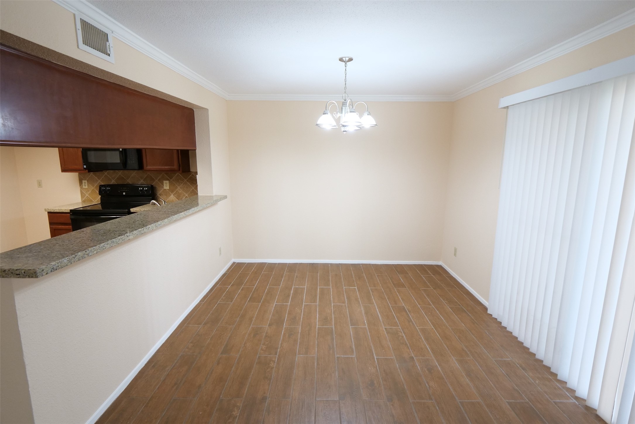 14911 Wunderlich Drive, Unit 2105 Houston, TX 77069 - Photo 9 of 24 a view of a kitchen with a sink and dishwasher with wooden floor