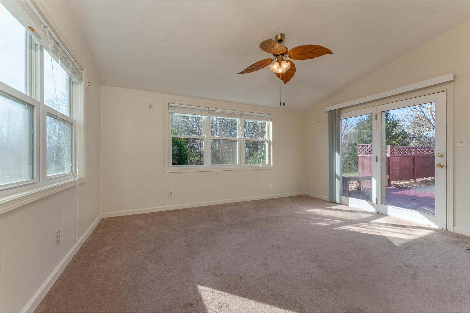 194 Stonebridge Drive Blue Ridge, VA 24064 - Photo 22 of 61 a view of a big room with windows and chandelier fan