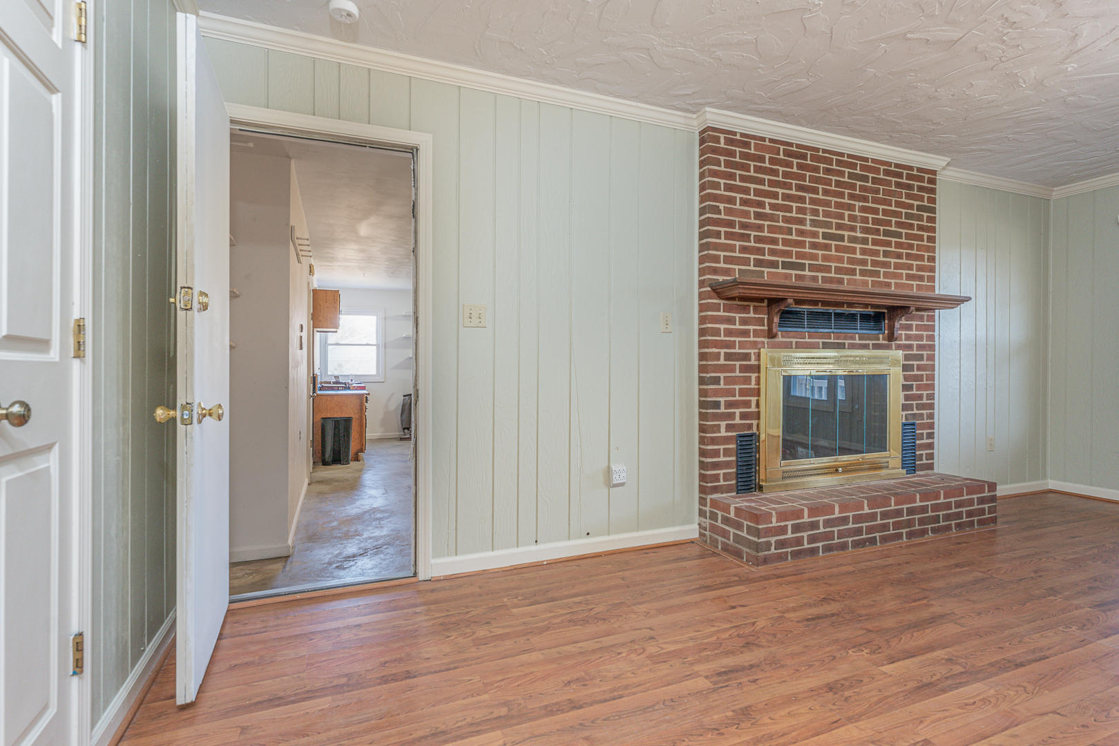 194 Stonebridge Drive Blue Ridge, VA 24064 - Photo 50 of 61 a view of an empty room with wooden floor a fireplace and a window