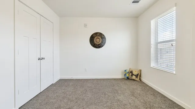 a view of livingroom with furniture and window