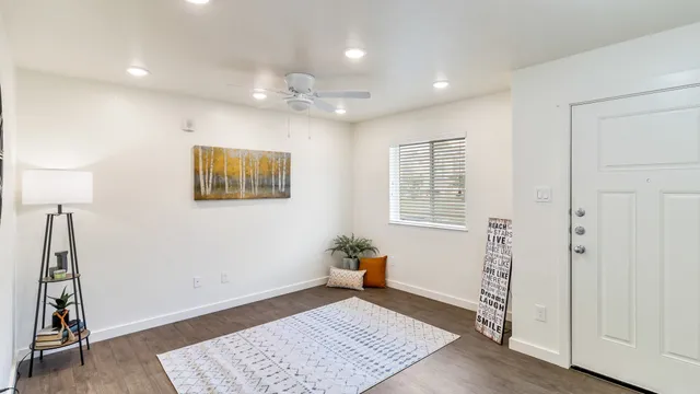 a view of a big room with windows and cabinet