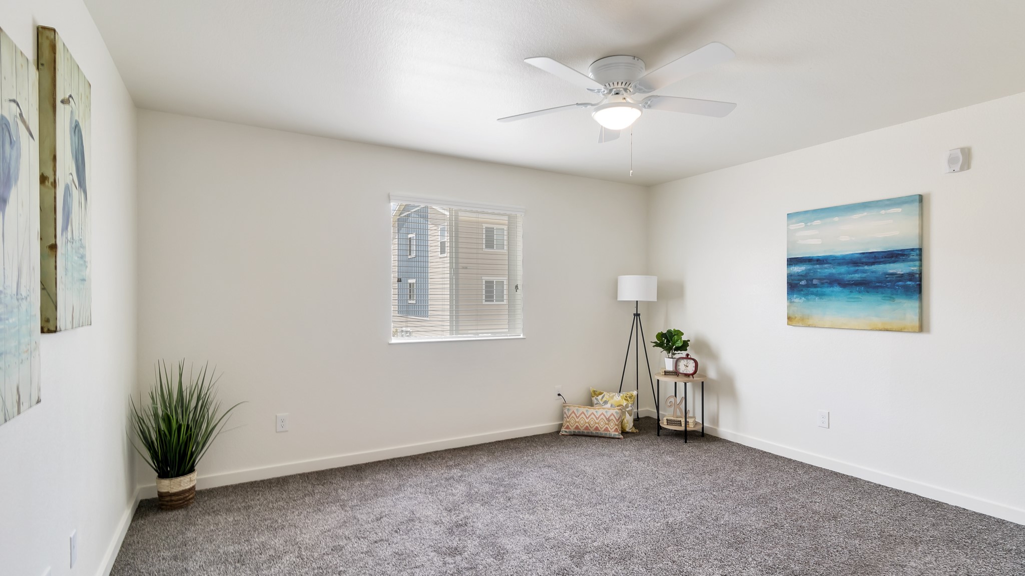 21155 Gosling Road, Unit 44C Spring, TX 77388 - Photo 4 of 31 an empty room with windows and ceiling fan