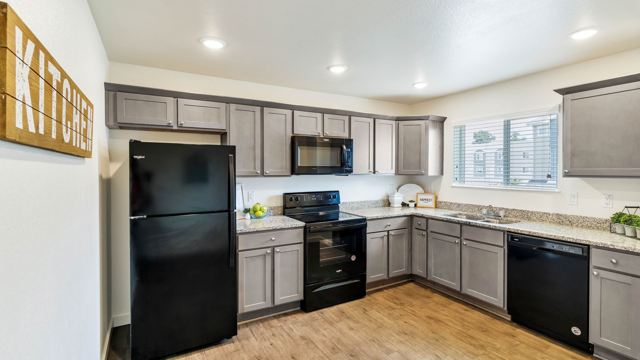 21155 Gosling Road, Unit 44C Spring, TX 77388 - Photo 6 of 31 a kitchen with a sink stainless steel appliances and cabinets
