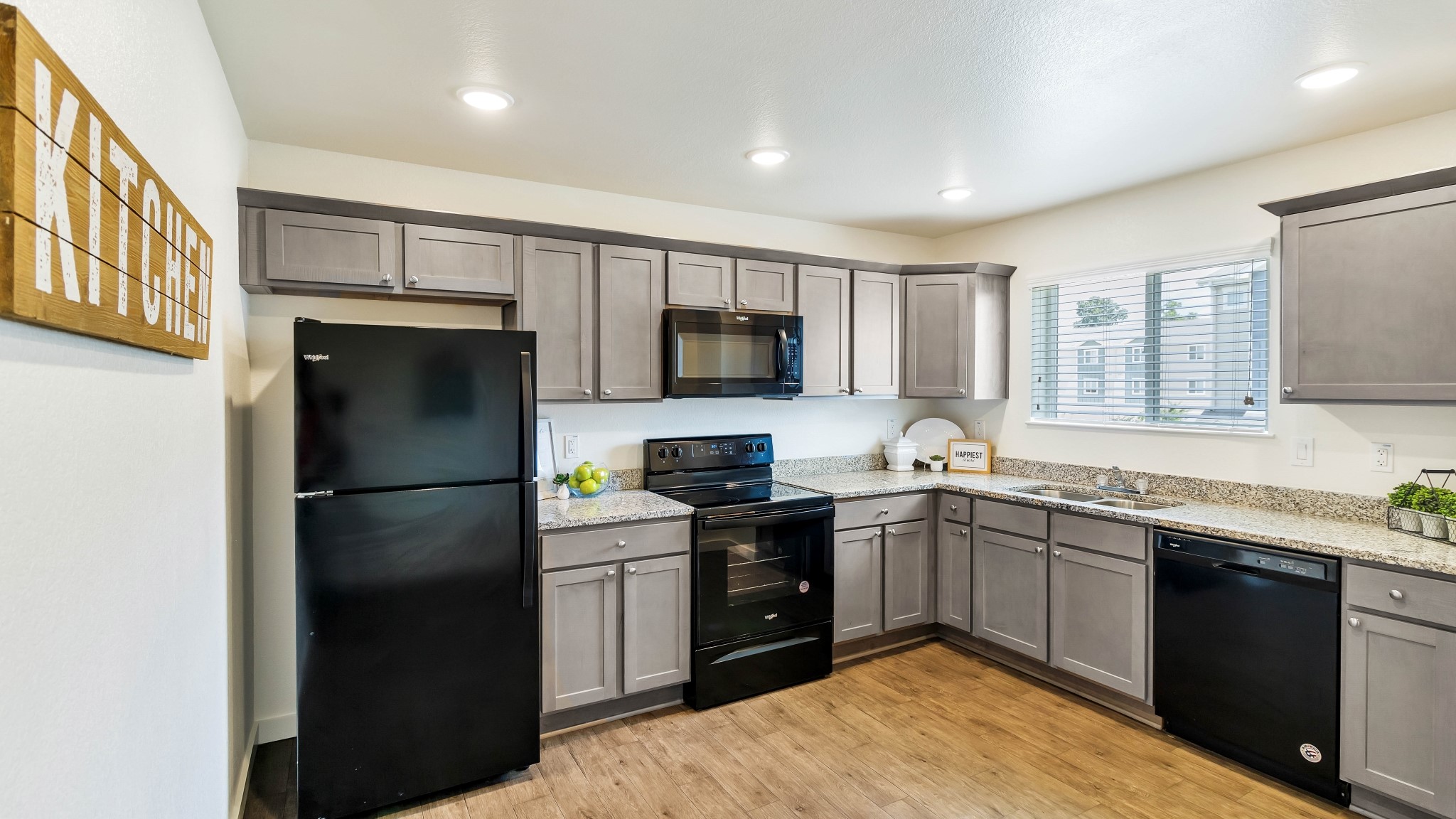 21155 Gosling Road, Unit 44C Spring, TX 77388 - Photo 7 of 31 a kitchen with a sink stainless steel appliances and cabinets
