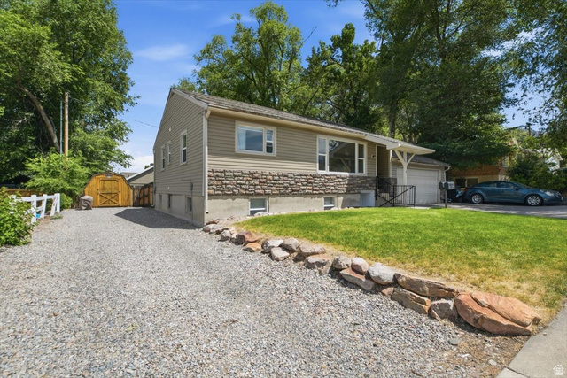 565 East 800 North Logan, UT 84321 - Photo 1 of 27 Split-level residence featuring tan siding and a stone facade