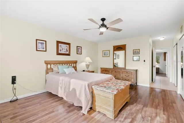 a bed room with a bed and a chandelier