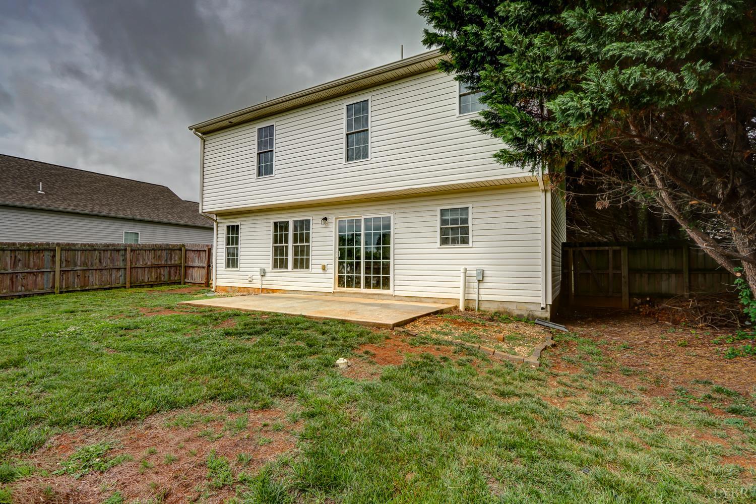 1057 Old Trail Road Forest, VA 24551 - Photo 45 of 49 a house that has a big yard large trees with wooden fence