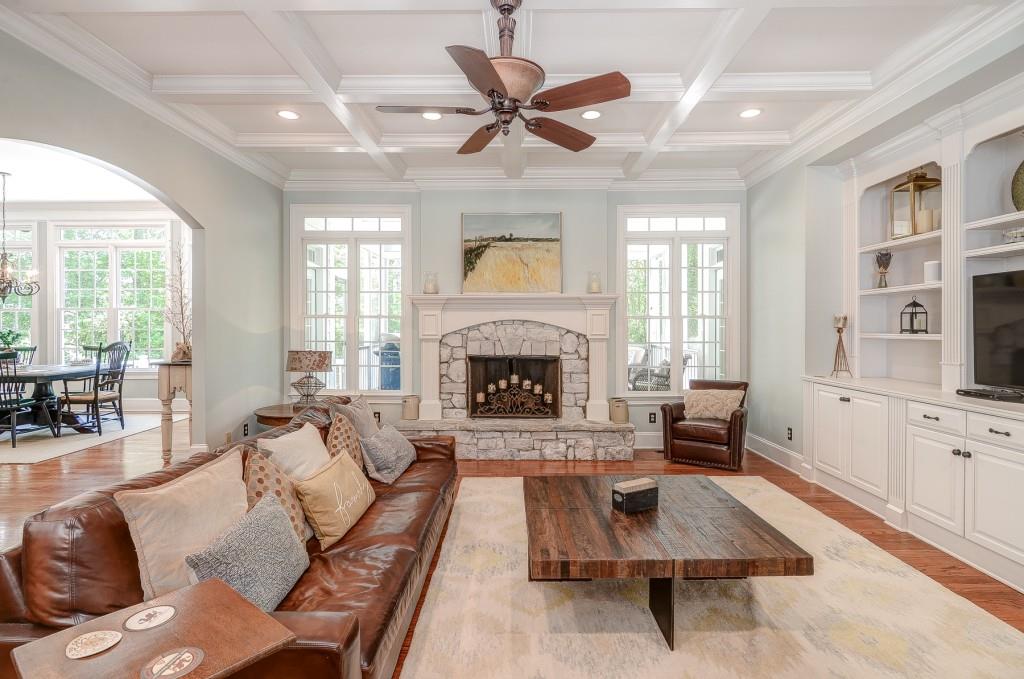 12595 Etris Road Roswell, GA 30075 - Photo 1 of 1 Spacious family room with gas fireplace, custom built-in bookcases and coffered ceilings make this the perfect room to relax with family & friends.