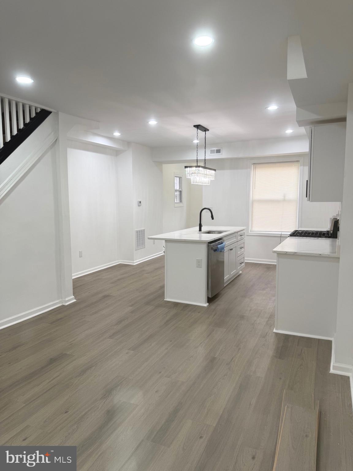 4803 Cordelia Avenue Baltimore, MD 21215 - Photo 1 of 39 a kitchen with a sink stainless steel appliances and cabinets