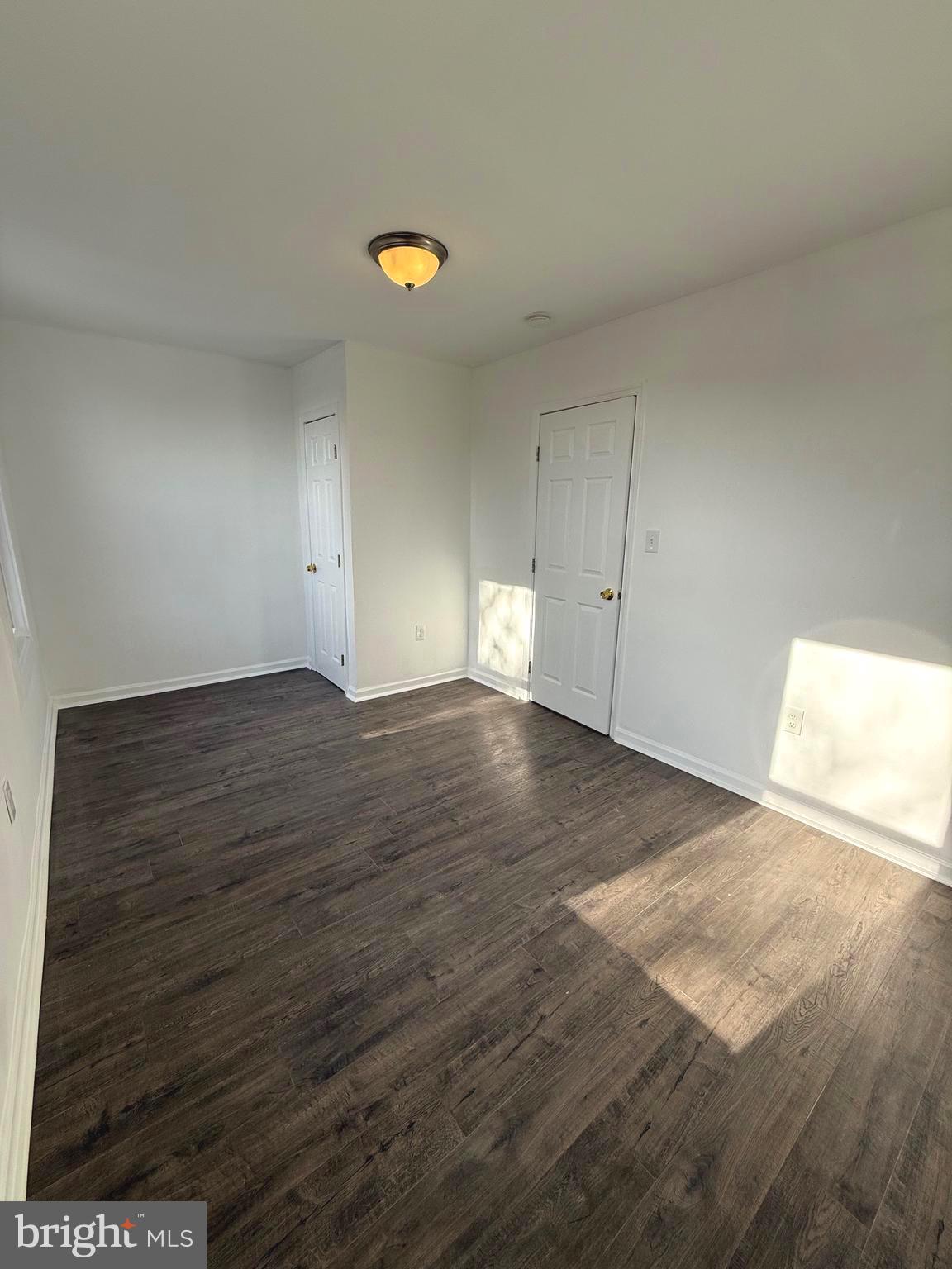 4803 Cordelia Avenue Baltimore, MD 21215 - Photo 12 of 39 a view of empty room with wooden floor