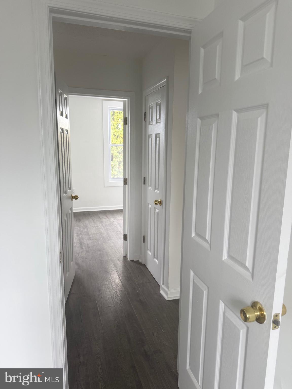 4803 Cordelia Avenue Baltimore, MD 21215 - Photo 20 of 39 a view of a hallway with wooden floor