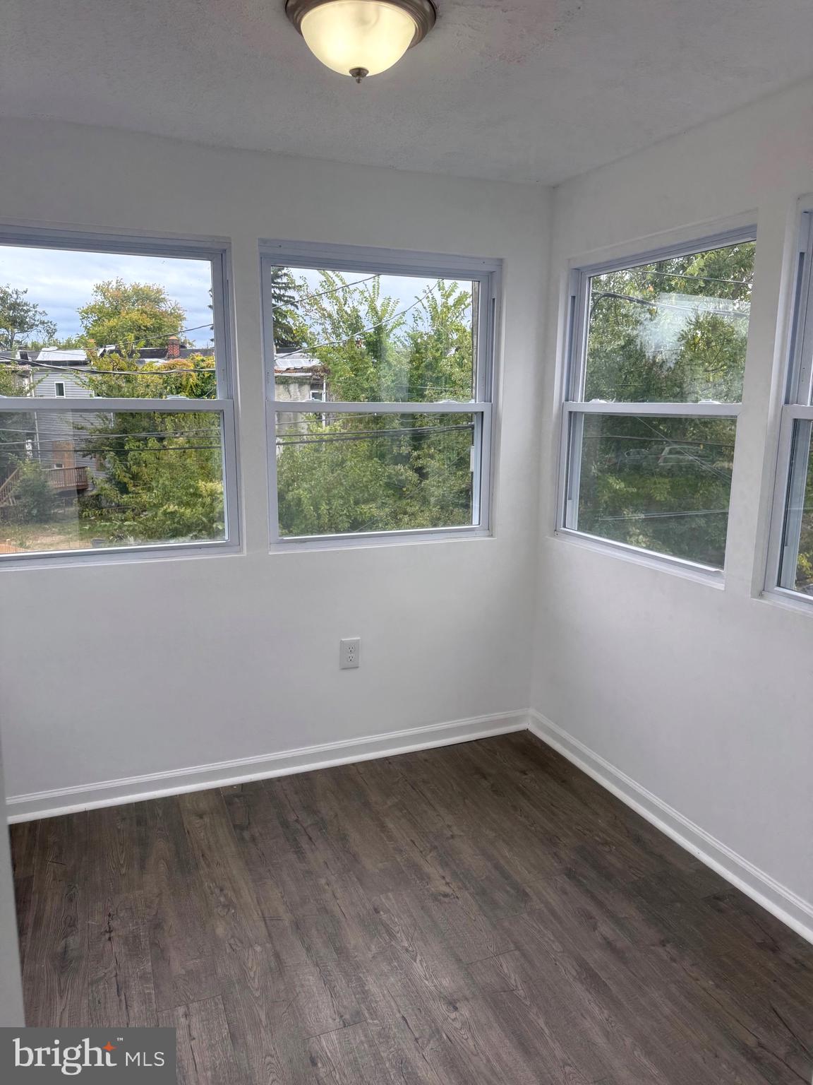 4803 Cordelia Avenue Baltimore, MD 21215 - Photo 22 of 39 a view of a room with wooden floor and a window