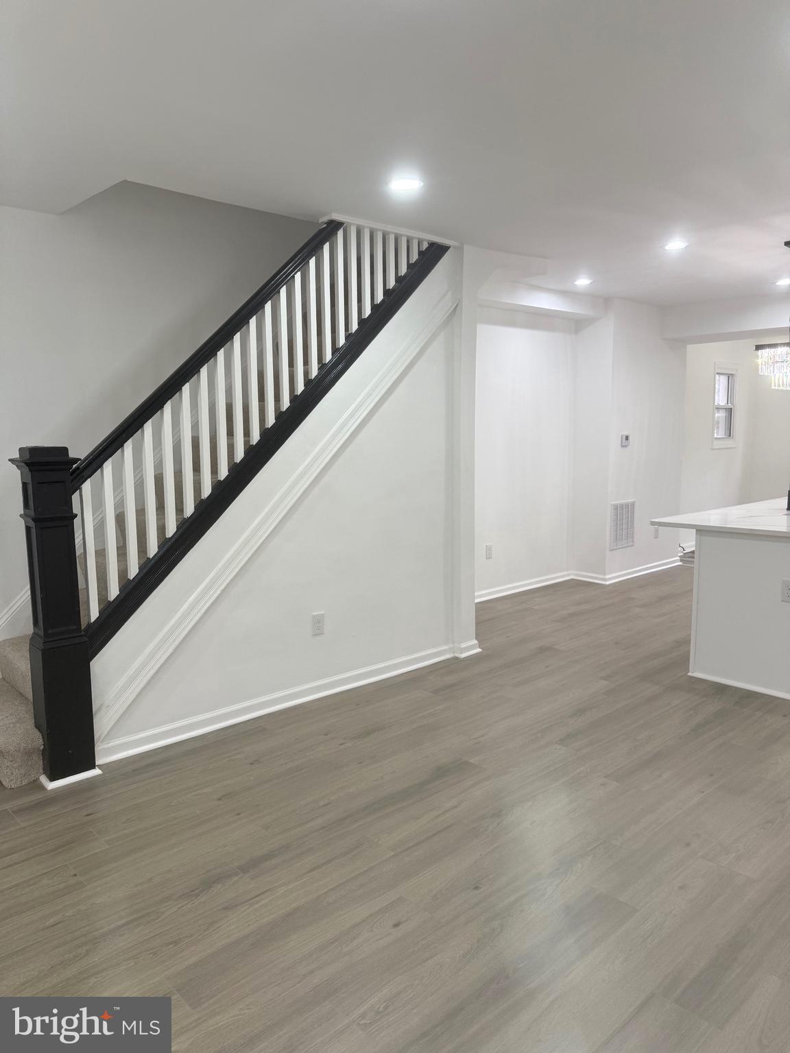 4803 Cordelia Avenue Baltimore, MD 21215 - Photo 3 of 39 a view of staircase with white walls and railing