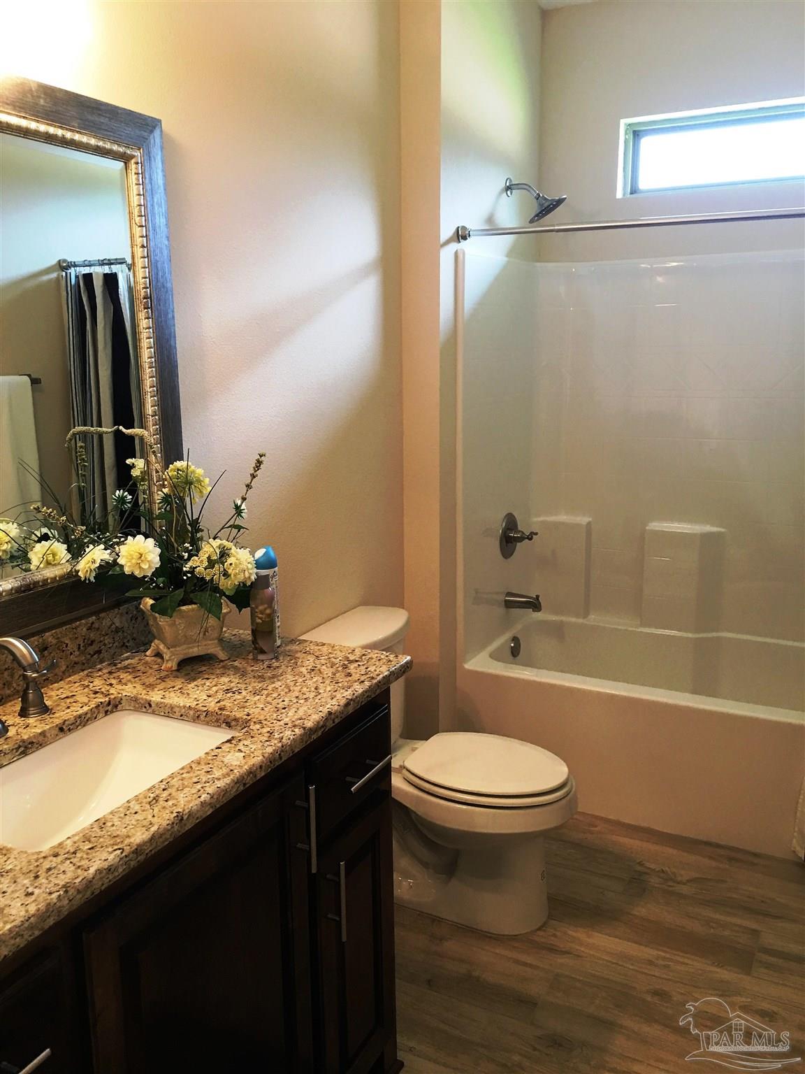 5210 South A Jones Road Milton, FL 32583 - Photo 16 of 37 A 3rd full bath has a shower/tub combination.