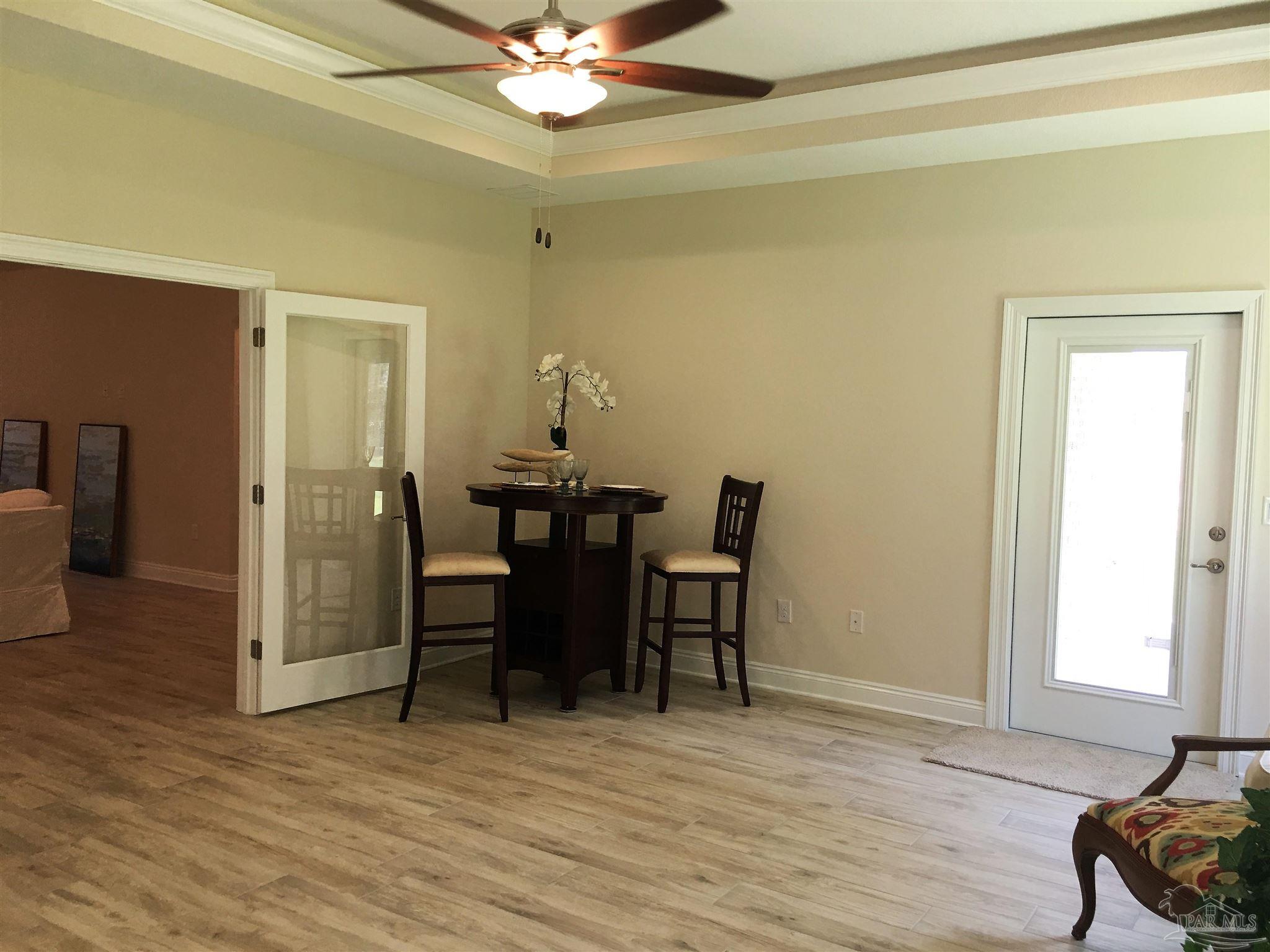 5210 South A Jones Road Milton, FL 32583 - Photo 23 of 37 Florida room has patio exit/entries both sides.