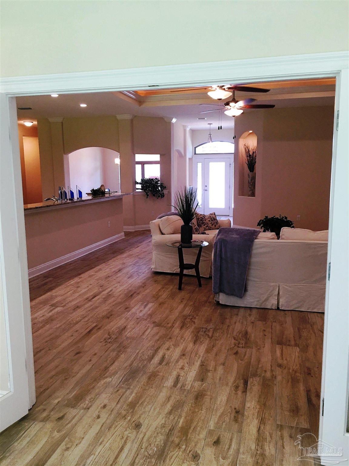 5210 South A Jones Road Milton, FL 32583 - Photo 24 of 37 Here's a view from Florida room to living room.
