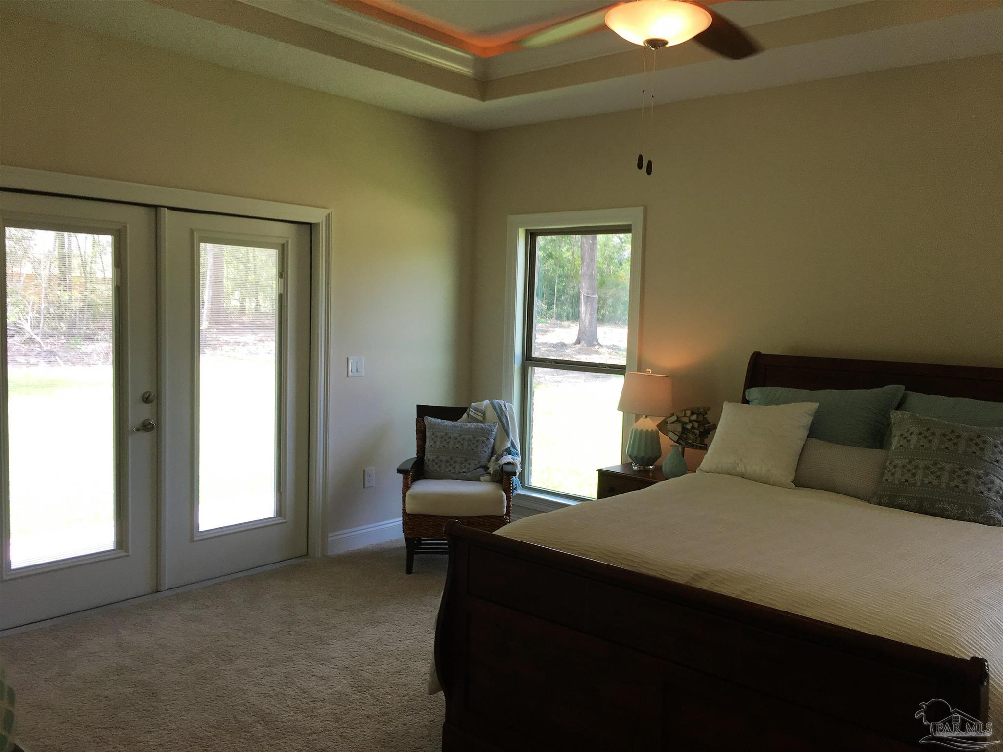 5210 South A Jones Road Milton, FL 32583 - Photo 25 of 37 Master bedroom has a box ceiling w/fan/light.