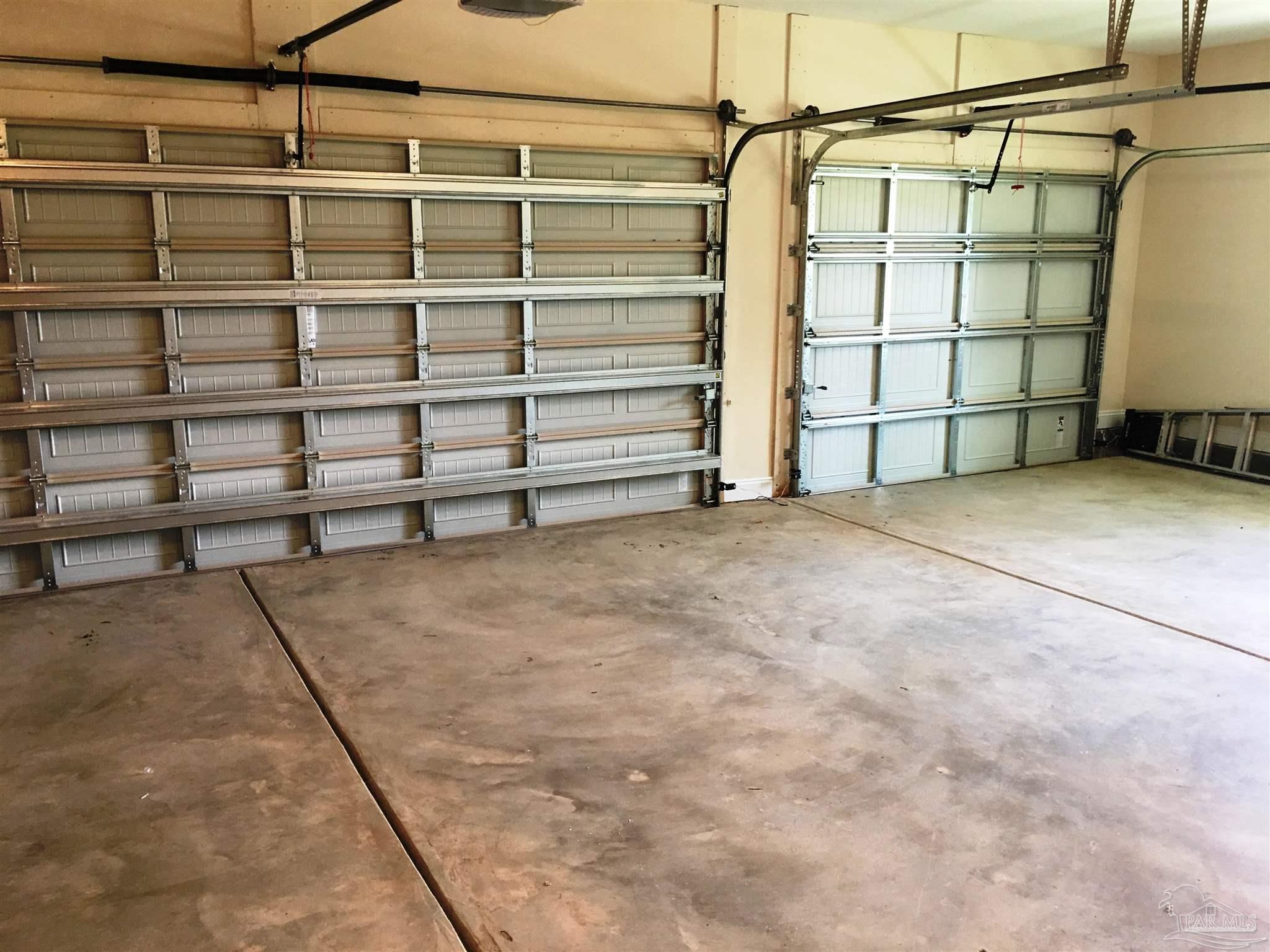 5210 South A Jones Road Milton, FL 32583 - Photo 3 of 37 A view of the 3-car garage interior is seen here.